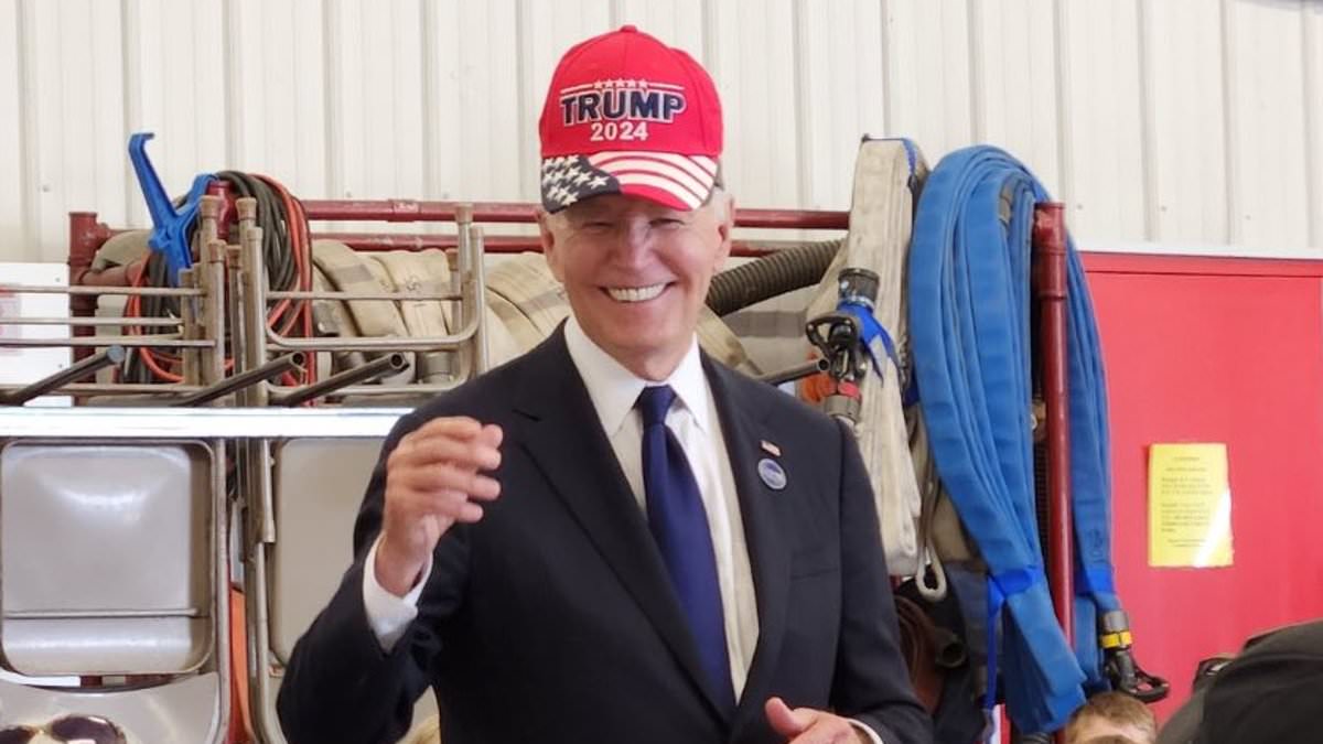 Bizarre moment Biden puts on a Trump hat at a fire station